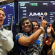 Jumia co-CEO Sacha Poignonnec applauds and Jumia Nigeria CEO Juliet Anammah